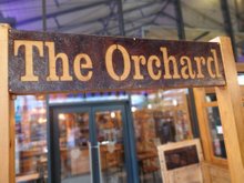 The Orchard rusty metal sign